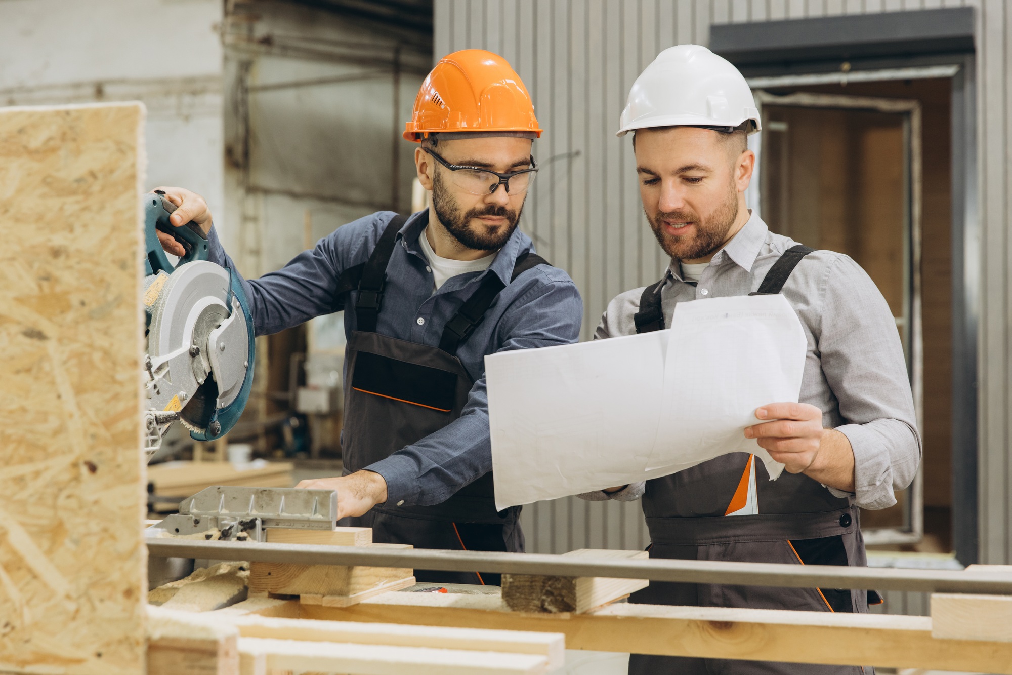 Builders working on modular home construction project
